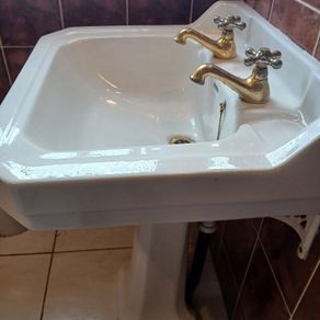 Bathroom sink, bath and bidet.