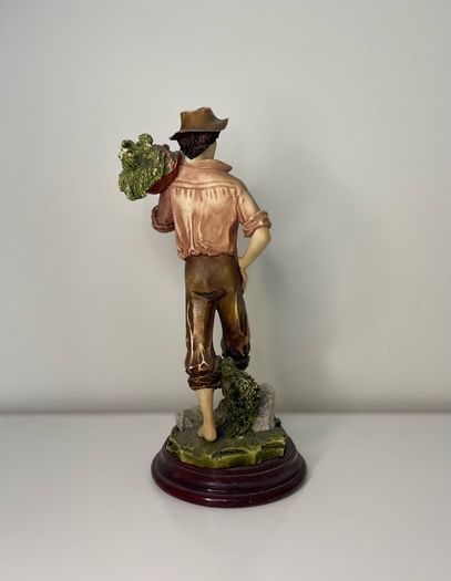Boy with a basket figurine signed Ballester