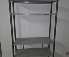 Metal shelving unit with 2 spare shelves.