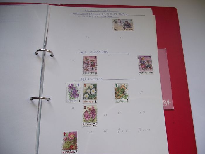 A collection of stamps from Isle of Man and Israel on albums pages (1950-1998) in the binder