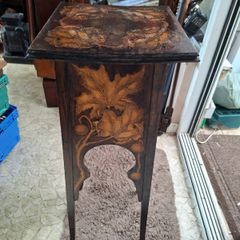 Antique Art Nouveau Table features intricate Pyrogravure Poker Work design around 1900 and arched supports