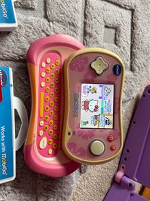 Vtech branded Mobigo 2 handheld game console WITH games