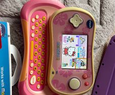Vtech branded Mobigo 2 handheld game console WITH games