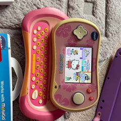 Vtech branded Mobigo 2 handheld game console WITH games