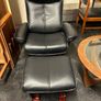 Pair of leather style armchairs with matching footstools Image 4