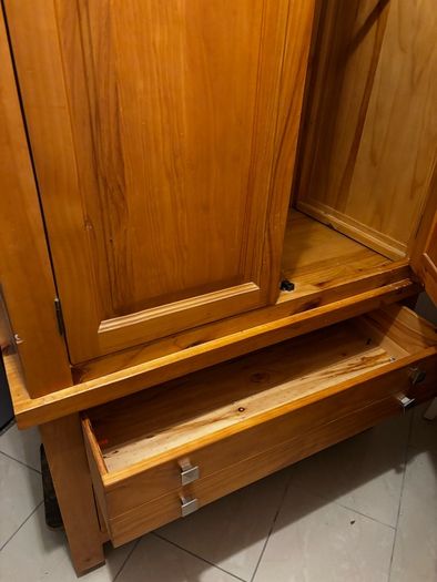 wardrobe with double hanging rails. 2 bottom drawers, 58cms deep and 106cms wide at the widest part.