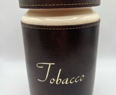 Antique tobacco jar with brass lion head