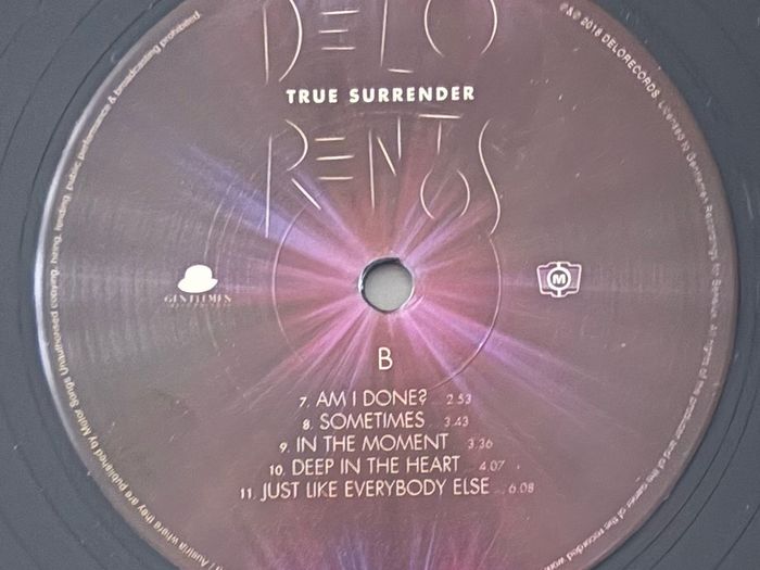 Delorentos - True Surrender. Printed inner sleeve. Played once. Like new except for a short and very minor seam split that's barely visible on photos. Bargain!