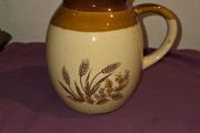 Vintage brown and tan water jug with wheat design