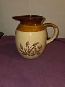 Vintage brown and tan water jug with wheat design
