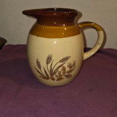 Vintage brown and tan water jug with wheat design