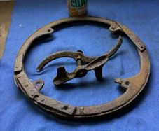 Cast iron band for end over end butter churn lid plus another misc butter churn item