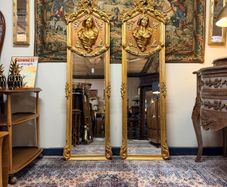 Pair of French Giltwood & Plaster Louis XVI Style Figural Beveled Mirrors