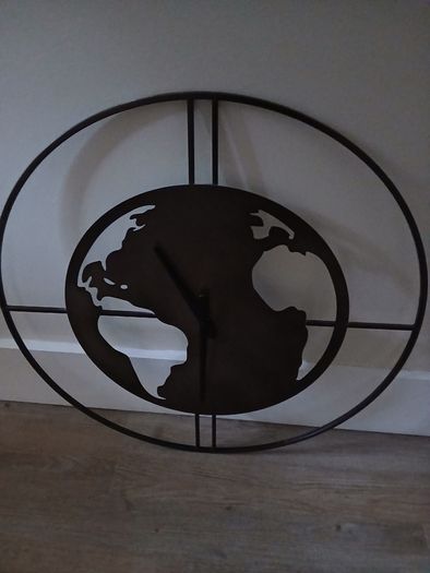 Clock in the shape of the world - needs attention