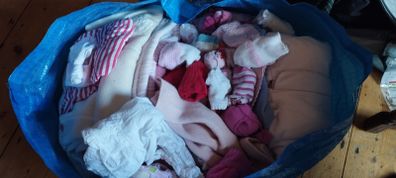 Bag of baby girl clothes