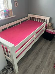 white wooden single bed