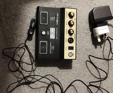 Roland EC 10M cajon module , power supply leads and 2 mics .