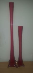 Tall red glass vase.