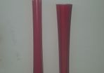 Tall red glass vase.