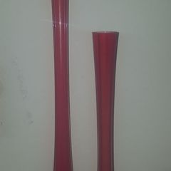 Tall red glass vase.