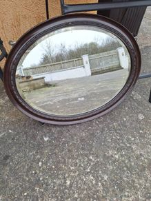 Antique oval bevelled mirror