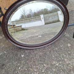 Antique oval bevelled mirror