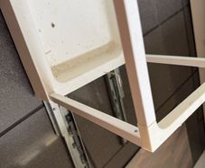 Pull out frame for waste bins