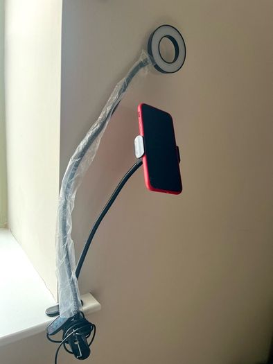 A Phone Stand with a supplementary Blue Light