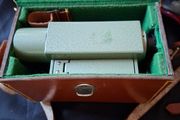Vickers S24 Surveying Level in Original Leather Case, The instrument features a distinctive green metal body. It is designed for high-precision leveling in construction and engineering application