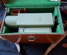 Vickers S24 Surveying Level in Original Leather Case, The instrument features a distinctive green metal body. It is designed for high-precision leveling in construction and engineering application