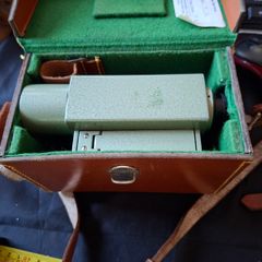 Vickers S24 Surveying Level in Original Leather Case, The instrument features a distinctive green metal body. It is designed for high-precision leveling in construction and engineering application