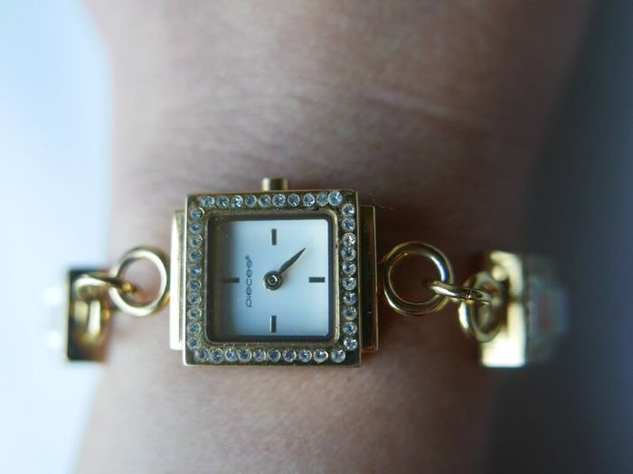 Pieces gold tone bracelet watch with crystal detail