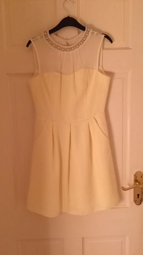 Dress with pearl neckline