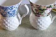 Set of 2 mugs decorative porcelain  fine bone china featuring a distinct textured, quilted or honeycomb base and intricate floral patterns.