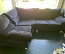 Black velvet corner sofa