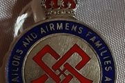 two militaria in this ad, boxed King's badge