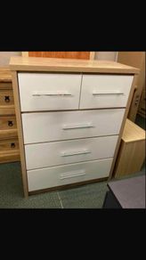 This is a Seconique Seville 5 Drawer Chest in White Gloss/Light Oak Effect Veneer.