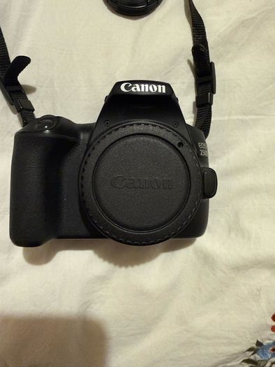 Canon EOS 250D DSLR Camera with + 50mm lens +18-135mm lens + and selfie tripod.