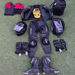 Motor cycle racing leathers with boots, gloves and helmet.