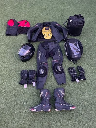 Motor cycle racing leathers with boots, gloves and helmet.