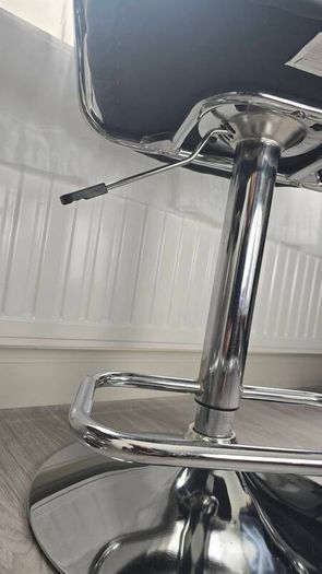 Adjustable black faux leather swivel bar stool with a metal base x3