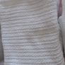 3 cellular baby blankets .Grey and white one are new  .One white one is slightly stained hence giving that one for free . Image 2