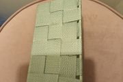 Green storage basket with metal frame