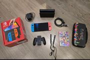 Nintendo Switch OLED Console + Mario Kart 8 Deluxe + Carry Case + Box
