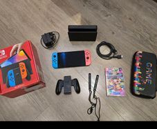 Nintendo Switch OLED Console + Mario Kart 8 Deluxe + Carry Case + Box