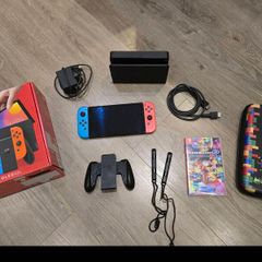 Nintendo Switch OLED Console + Mario Kart 8 Deluxe + Carry Case + Box