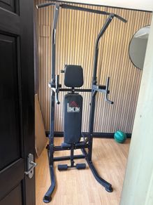Multifunction power tower built in weight bench pull up and dip station