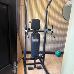 Multifunction power tower built in weight bench pull up and dip station