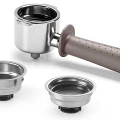 DeLonghi espresso machine with portafilter and accessories