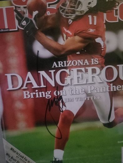 Framed Larry Fitzgerald autographed sports illustrated magazine with Cos
